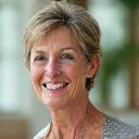 Photo of Ava G., a radiant woman in her late 40s, looking healthy and vibrant.