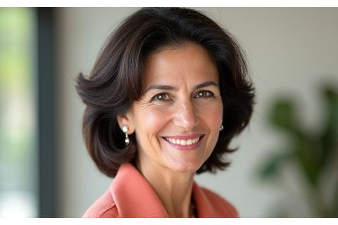 Sara Khan, an empathetic wellness coach, in a natural light setting.