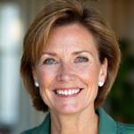 Sarah, 42, smiling and looking vibrant after her wellness transformation